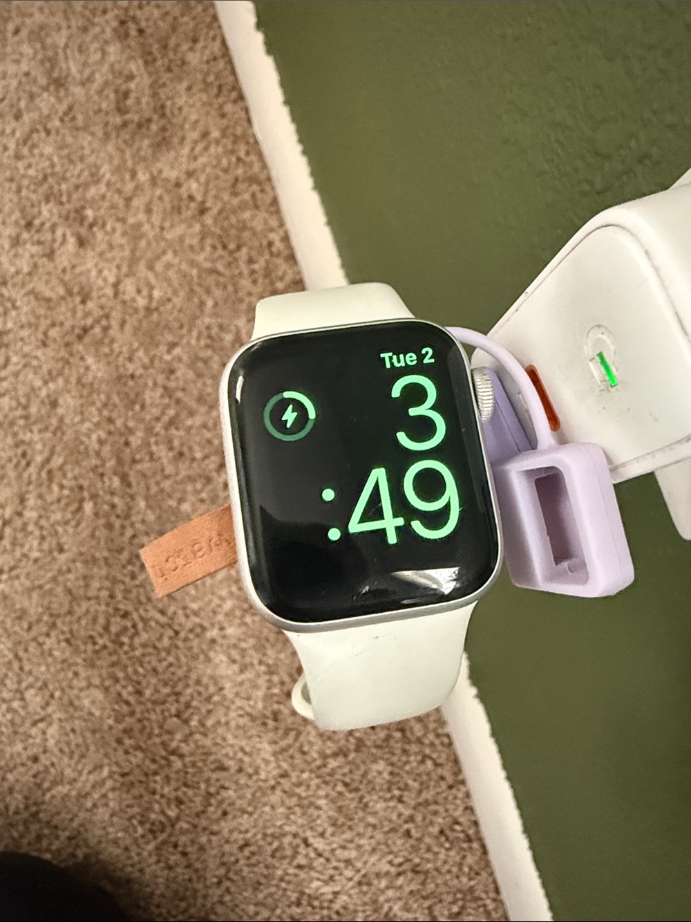 Apple Watch with White Sport Band and Lavender Charging Holder